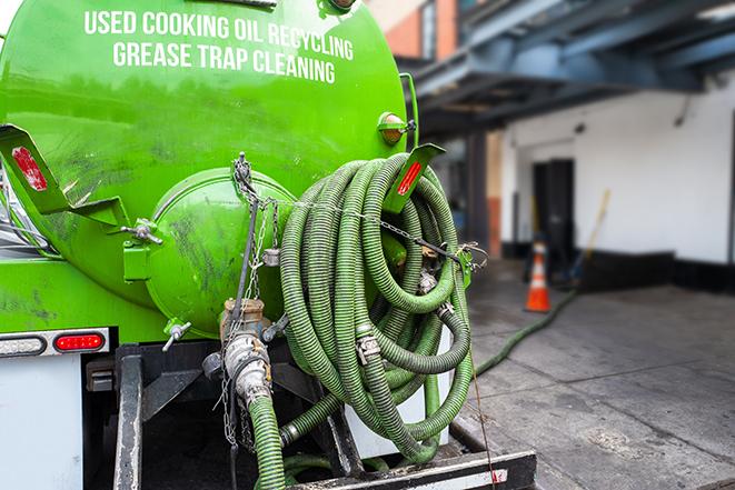 pumping out grease and sludge from a trap in New Castle